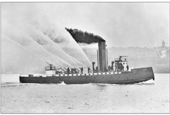 Seattle fireboat Duwamish in 1910 steaming on water with crew on deck