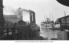Historic image showing Fireboat Duwamish and steamer Island Flyer docked at Fire Station No. 5, Seattle, circa 1912