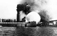 Fireboat DUWAMISH battling fire at Montana Street Mill lumberyard on East Duwamish Waterway in Seattle