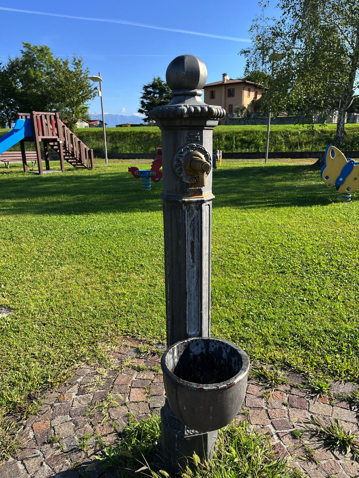 Fontana Caporiacco fountain with sculptural details and water features