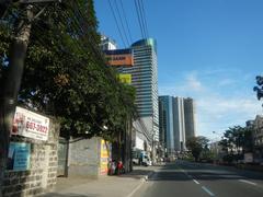 Aerial view of modern high-rise buildings in Eastwood City, Quezon City, Metro Manila, Philippines under blue sky