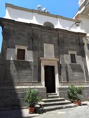 Interior view of the historical Cappella dei Pontano with detailed frescoes and architectural features