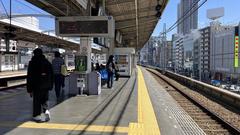 Hanshin Noda Station platform with railway tracks and overhead structures