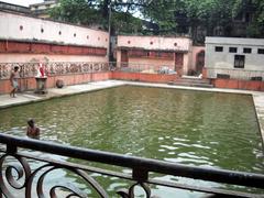 Kundupukur sacred tank at Kalighat Kali temple with traditional architecture
