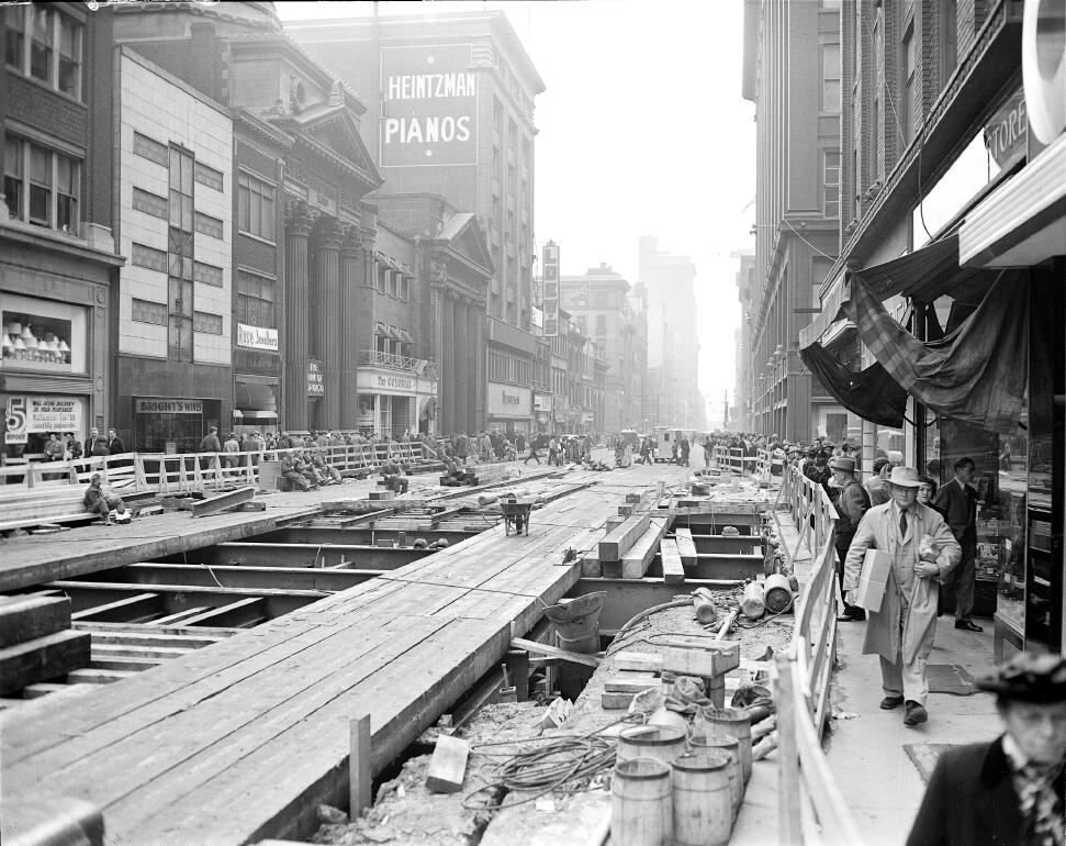 1949 Yonge Street subway construction in Toronto with Eaton's department store and Loew's cinema