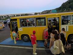 Evening bus arriving at Tokyo Summerland amusement park in Akiruno City, Tokyo
