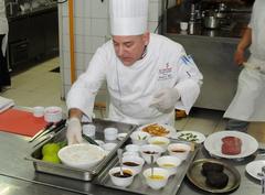 Cooking demonstration featuring American and Indonesian chefs blending culinary techniques and ingredients from East and West
