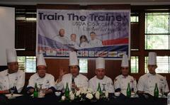 USDA Council of Chefs cooking demonstration with American, Filipino, and Indonesian chefs blending Eastern and Western cuisines