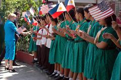 U.S. Ambassador Kristie Kenney and Deputy Chief of Mission Paul Jones greeted by Manila High School students during classroom renovation project in Manila