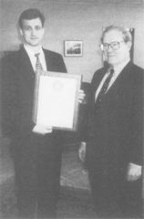 Consular officer Thomas Vadja receiving Superior Honor Award from Ambassador James Laney at US Embassy Seoul