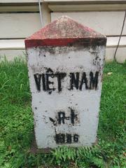 Vietnam Museum of Revolution building exterior with flags and stairs