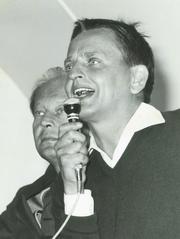 Olof Palme delivering the first speech in Almedalen Park in 1968, Gotland, with Krister Wickman standing behind