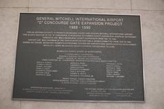 Interior view of Milwaukee Mitchell International Airport Concourse D with seating and shops
