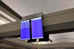 Milwaukee Mitchell International Airport Concourse D interior with seating and signage