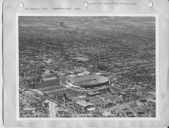 Historic black and white photo of Los Angeles cityscape with downtown buildings and mountainous background