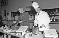 Group Captain H.O. McDonald and Air Vice-Marshal G.O. Johnson serving Christmas dinner to airmen in 1942 RCAF Manning Depot Toronto