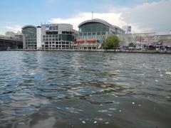 Quezon Bridge Ferry Station on Pasig River in Manila with ferry boats and city buildings