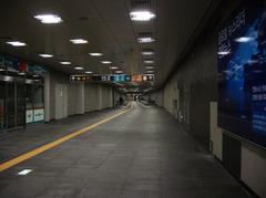 Transfer passage at AREX Digital Media City Station with travelers walking through