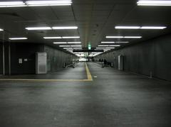 Transfer passage at AREX Hongik University Station with escalators and signage