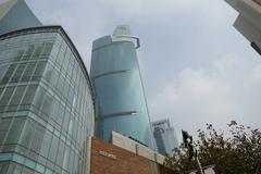Buildings at Nanjing West Road in Shanghai with modern architecture and blue sky