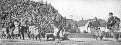 George Lawton running with the football away from defenders during a 1910 Michigan vs Minnesota game