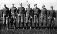 Coaching staff of the 1921 Michigan Wolverines football team including Fielding H. Yost, Elton Wieman, Angus Goetz, Ray Fisher, E. J. Mather, A. J. Sturzenegger, and Archie Hahn
