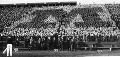 Crowd displaying 'Block M' at 1914 Michigan vs Penn football game at Ferry Field