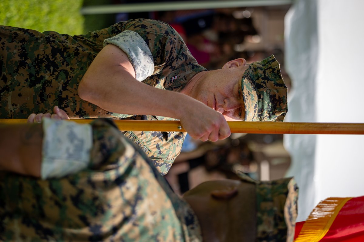 U.S. Marine Corps Maj. Gen. Mark Cunningham receiving colors from Sgt. Maj. Russell Boley during change of command ceremony