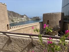 View from the top of Al Mirani Fort tower showcasing the fort's stone walls and surrounding landscape