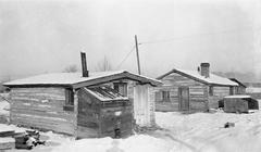 Historic log cabins in Calgary, Alberta, known as Hunt House, representing early Hudson's Bay Company post structures