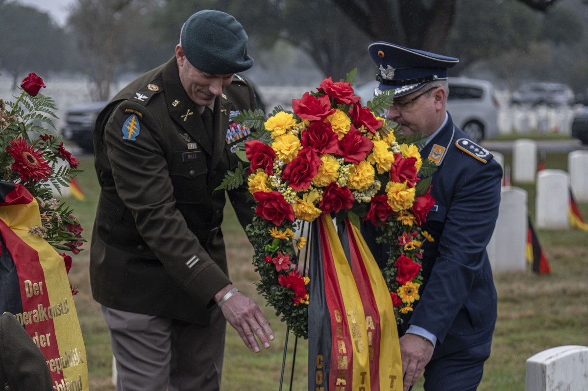 German Memorial Day ceremony at Fort Sam Houston National Cemetery with soldiers, civilians, and families honoring fallen soldiers