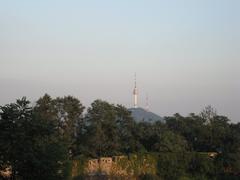 Seoul city wall in August 2007 with traditional Korean architecture and stone fortress