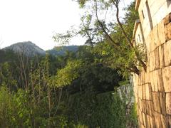 Seoul city wall in August 2007 with traditional stone construction and surrounding green landscape