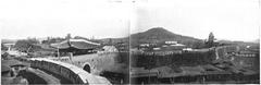 Panoramic view of Seoul city with high-rise buildings and mountains in the background