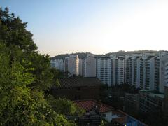 Seoul city wall in August 2007 with greenery and blue sky