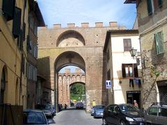 Porta Ovile gate in Siena, Italy, historic stone entrance with arches and medieval architecture