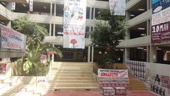 Atrium of the School of Philosophy at Athens University decorated with student political faction flyers for the May 10, 2023 student elections