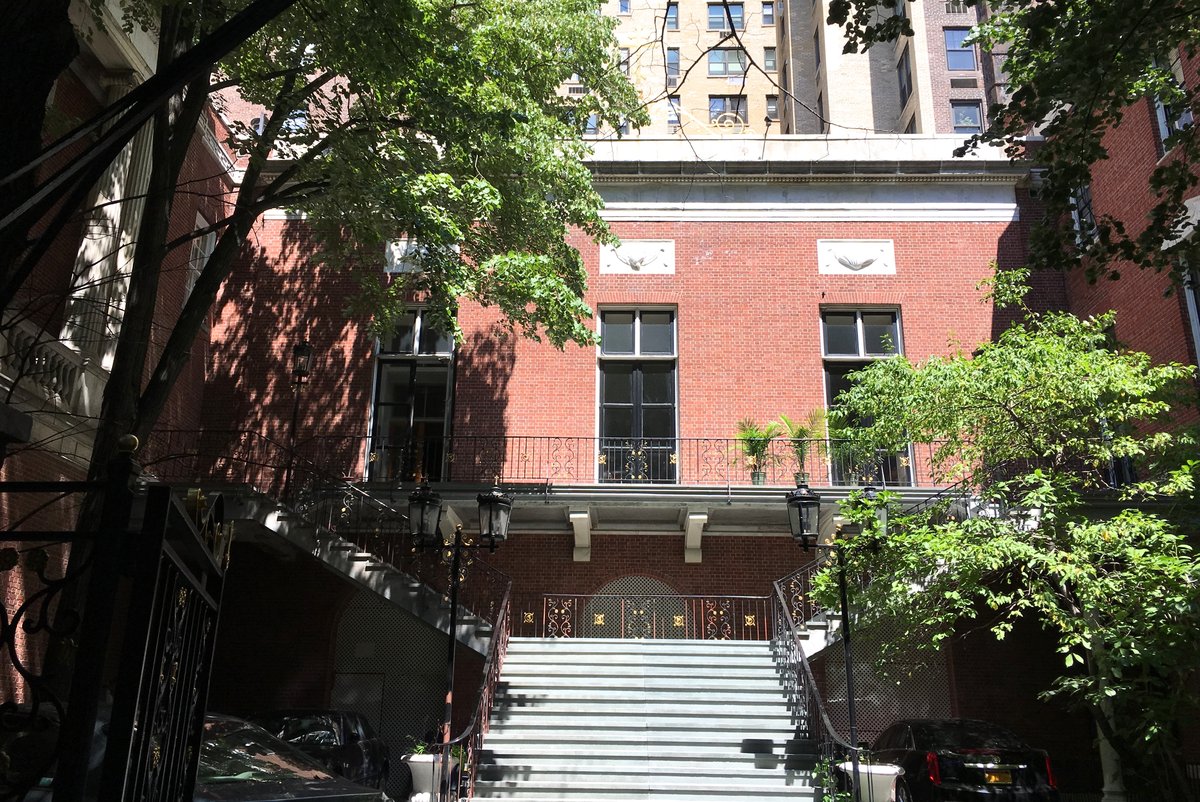 Elegant ballroom wing of 75 East 93rd Street in New York City with classic architectural details and ambient lighting