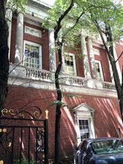 Colonnades of 69 East 93rd St residential building in New York City with tall classical columns
