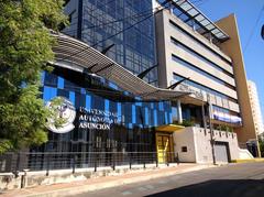 Main building of Universidad Autónoma de Asunción with modern architecture and clear sky