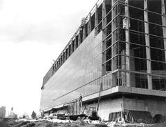 Construction site of Veterans Memorial Coliseum in Portland Oregon with steel framework and cranes