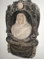Elegant epitaph of J.J. Pock inscribed on a dark stone slab with decorative border