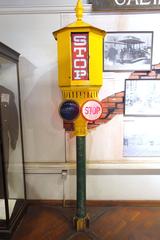 San Francisco Cable Car Museum stoplight with historical cable car machinery in the background