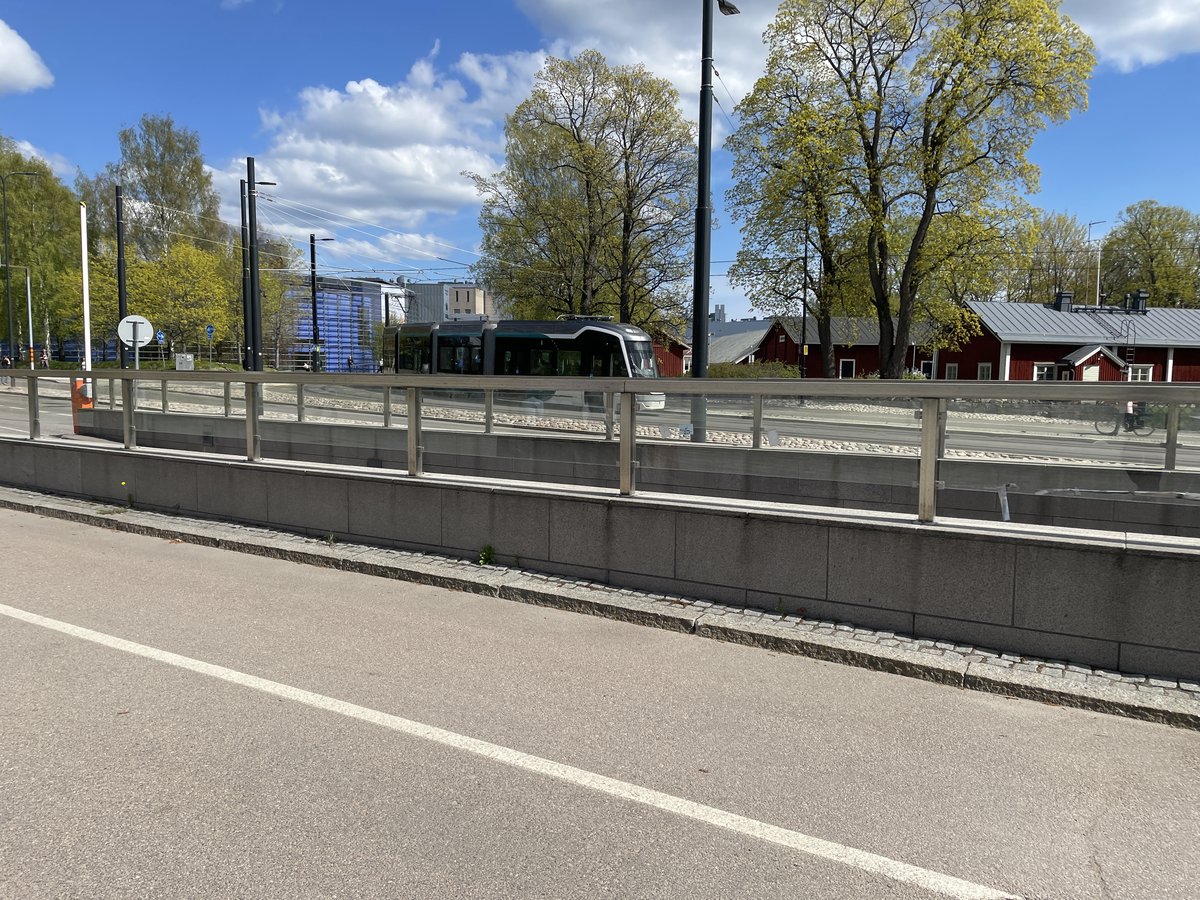 Tram 15 Raide-Jokeri in Viikki with Viikki manor buildings in the background