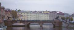 Anichkov Bridge viewed downstream with historic architecture and river flowing beneath