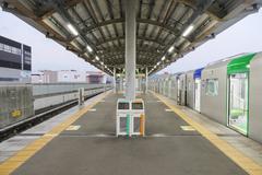 Platforms 1 and 2 of Gakken Nara Tomigaoka Station on the Kintetsu Keihanna Line with modern station design