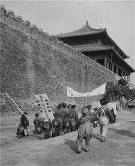 1948 US election campaign in Beijing with a group of people carrying an elephant with Dewey's portrait