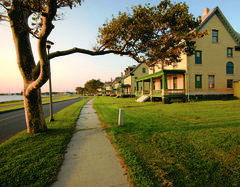 Historic Fort Hancock Officers' Row buildings lined up under a clear blue sky