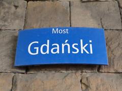 MSI plaque with the name of Gdański Bridge in Warsaw on the Praga side