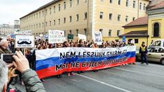 Demonstration of the Hungarian Two-tailed Dog Party in Budapest with colorful flags and banners